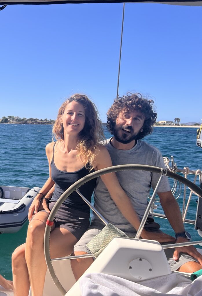 Couple onboard their sailing boat